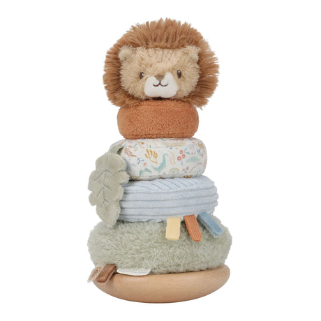 A plush lion baby toy with a soft brown mane, cream face, and patterned fabric body, stacked on a wooden base with textured fabric layers and small sensory tabs, photographed on a white background.