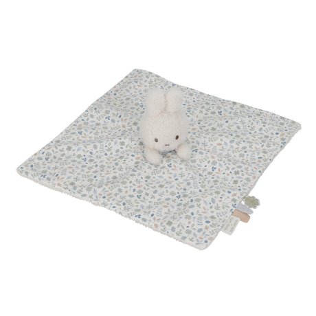 Miffy Plush toy on a floral-patterned blanket with a white background