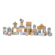 A collection of wooden building blocks in various shapes and sizes, decorated with ducks, birds and a frog. The blocks are in shades of blue, beige, and different colours. 