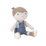 Stuffed toy boy rag doll with brown hair, striped shirt, and blue overalls on a white background
