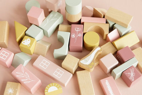 Set of pink and green baby building blocks with illustrations of wildlife