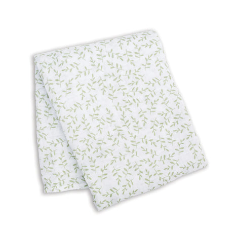 White fabric with green leaf pattern on a white background