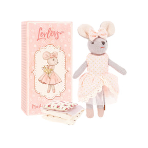 Plush mouse toy with a dress next to its matchbox painted packaging on a white background