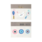 Packaged tattoos with bird designs and circle patterns on a white background