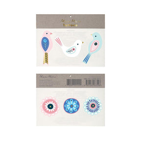 Packaged tattoos with bird designs and circle patterns on a white background