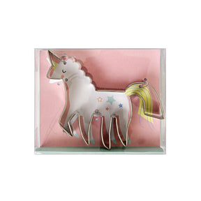 A stainless steel cookie cutter in the shape of a unicorn with multicolored stars and a yellow tail.