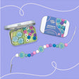Cotton Twist Mermaid bracelet kids craft  kit with beads and packaging on a purple background