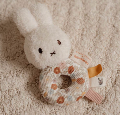 Close-up of Little Dutch Miffy Vintage Flowers ring rattle on cream rug showing Miffy face and vintage floral ring