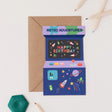Colourful birthday card with arcade design and 'Astro Adventures' text on a white background.
