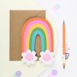 Mifkins Rainbow Blossom Birthday Card - die-cut rainbow arch with smiling flower characters and kraft envelope
