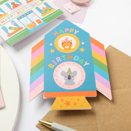 Colorful childrens Rocket birthday card with a koala design on a white background