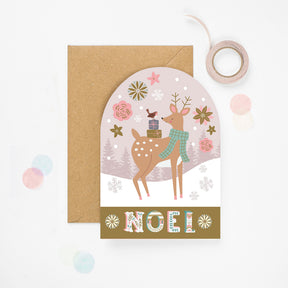 Christmas card with a deer illustration and 'Noel' text, featuring a brown envelope.