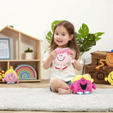 Young girl holding Rainbow Designs Little Miss Hug soft plush toy with Mr. Men characters in the background