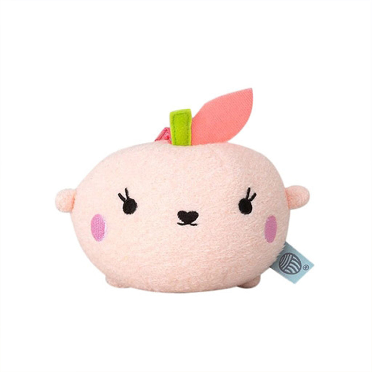 Soft toy shaped like a pink peach with a cute face on a white background