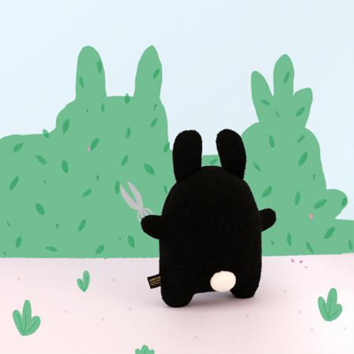 Black and white bunny soft toy with pom pom tail