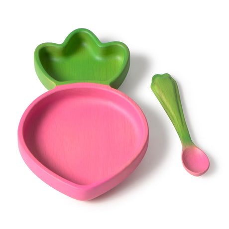 Wooden pink and green children's raddish shaped bowl and spoon set on a white background