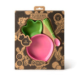 Oli & Carol Ramona wooden baby feeding set in its packaging, featuring a pink Raddish shaped bowl and a green and pink spoon.