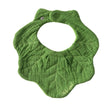 Green textured baby bib in the shape of a kale leaf from Oli and Carol on a white background