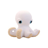 White octopus rubber toy with blue eyes on a white background