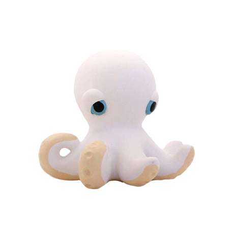 White octopus rubber toy with blue eyes on a white background