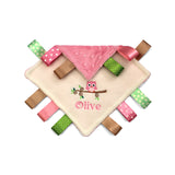 Baby comfort blanket with Owl design colourful pink and green tags and an embroidered owl design on a white background
