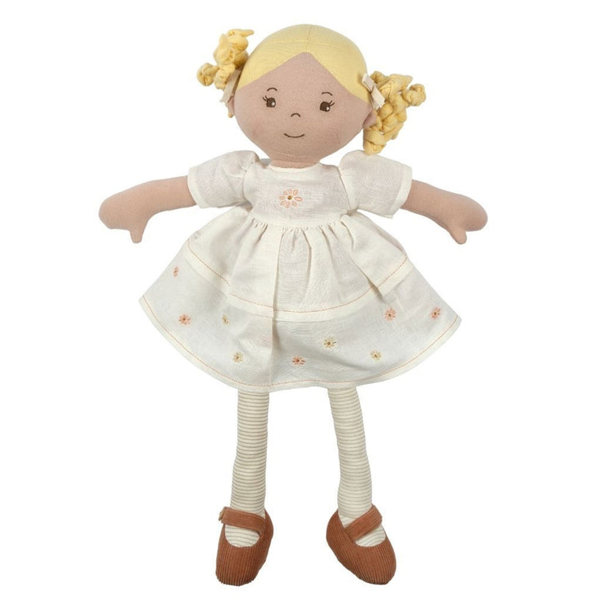 Stuffed doll with blonde hair, wearing a white dress with flower patterns and brown shoes on a white background.