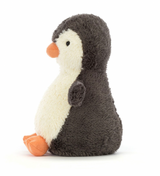 A small plush toy resembling a peanut-shaped penguin with soft grey and white fur, featuring a friendly face and flippers.
