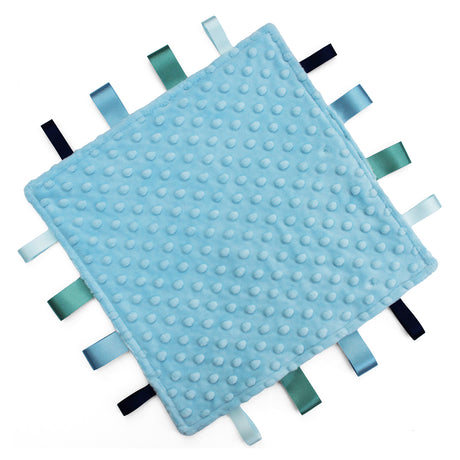 A square baby taggy comforter with a light blue textured minky fabric and ribbon tabs in shades of blue, green, and black on a white background.