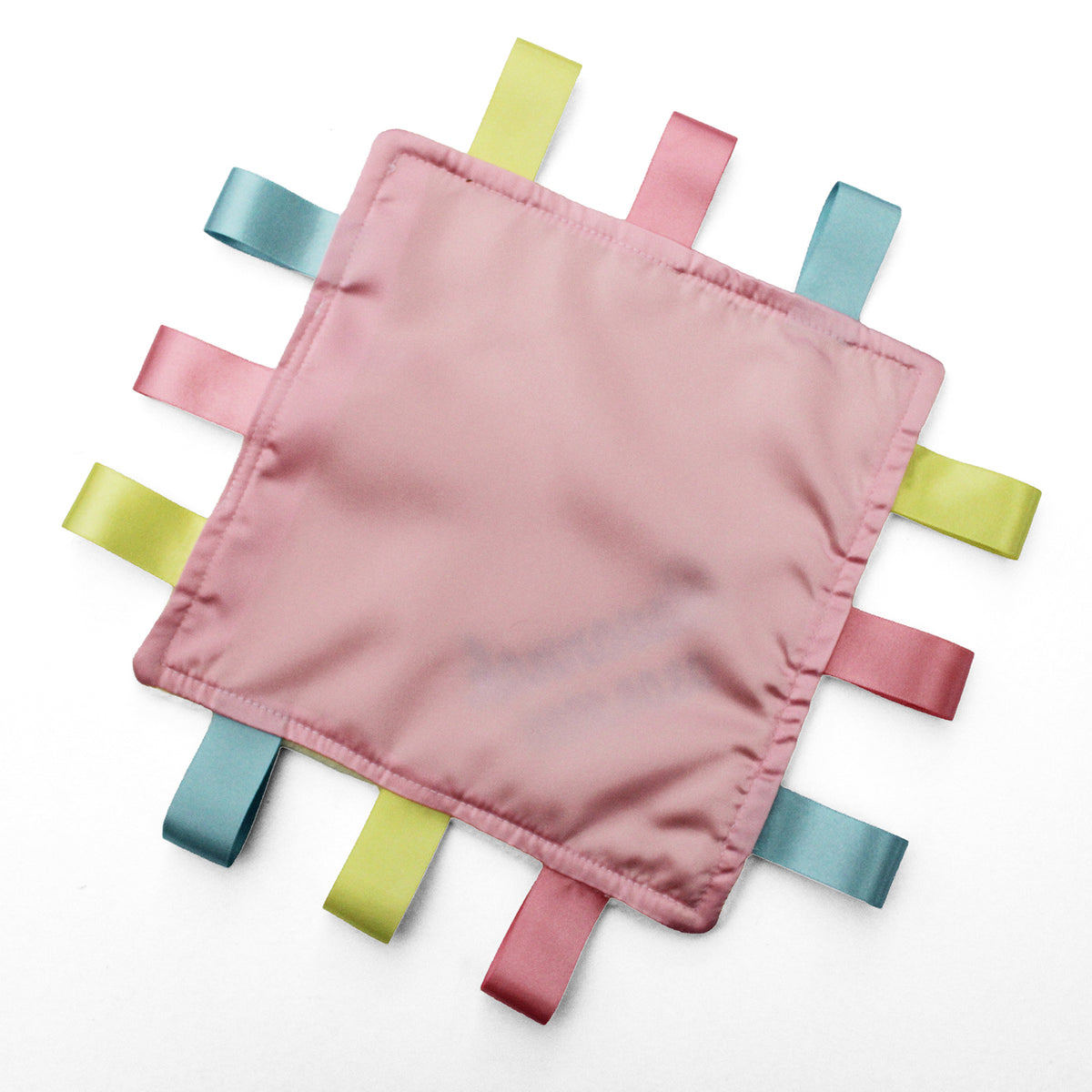 A square pink satin fabric sensory baby comforter with 12 colourful satin ribbon tabs radiating from the edges, shown on a plain white background.