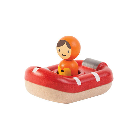Toy lifeboat with a figure on a white background