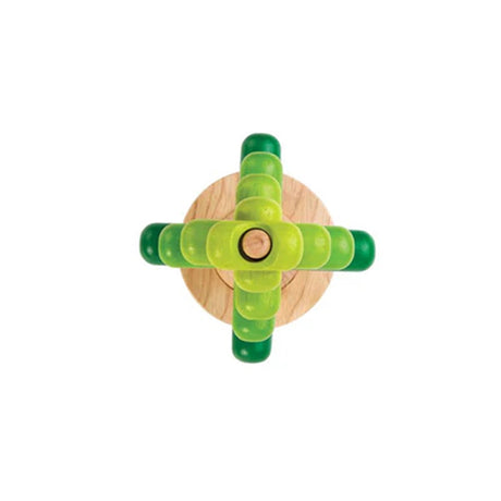 Green wooden Stacking tree toy with a natural wood base birds eye view on a white background
