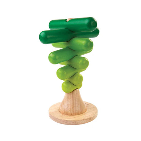 Green wooden Stacking tree toy with a natural wood base on a white background