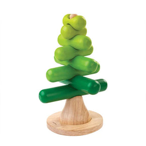 Green wooden Stacking tree toy with a natural wood base on a white background