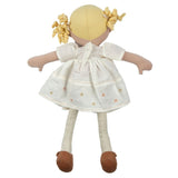 Toy doll with blonde hair, white dress, and brown shoes on a white background