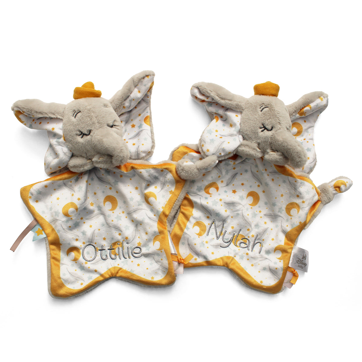 Two plush elephant-shaped baby comforters with starry fabric bodies and yellow trim, shown on a white background. 