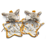 Two plush elephant-shaped baby comforters with starry fabric bodies and yellow trim, shown on a white background. 