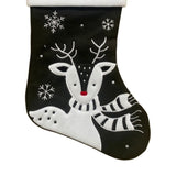 Black Christmas stocking with a reindeer design on a white background