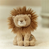 Plush lion toy with a soft texture on a beige background