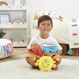 Boy holding Mr Men characters Mr Square, Mr Bump and Little Miss Happy in a bedroom