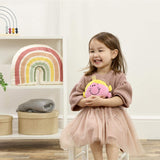 Litlle girl in room holding Little Miss Princess