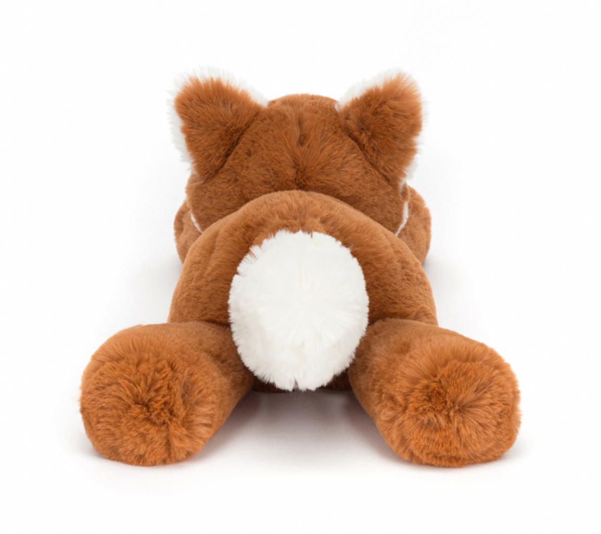 A plush toy representing a dark orange fox with fluffy cream ears and a tail, lying down on a plain background.