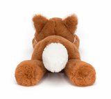 A plush toy representing a dark orange fox with fluffy cream ears and a tail, lying down on a plain background.