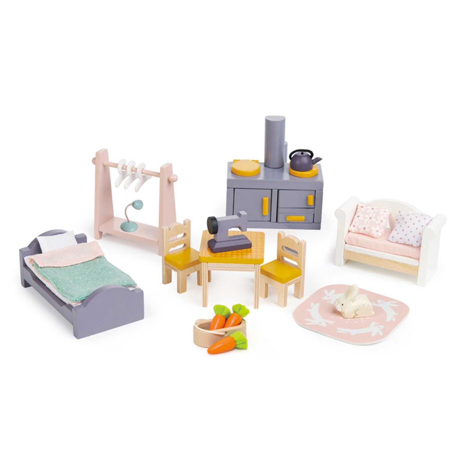 Set of toy wooden furniture including a bed, dining table, and chairs on a white background