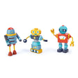 Three colorful wooden robot toy figures on a white background