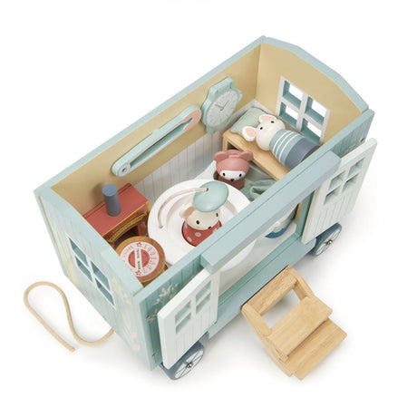 Wooden toy Shepherd Hut and accessories on a white background