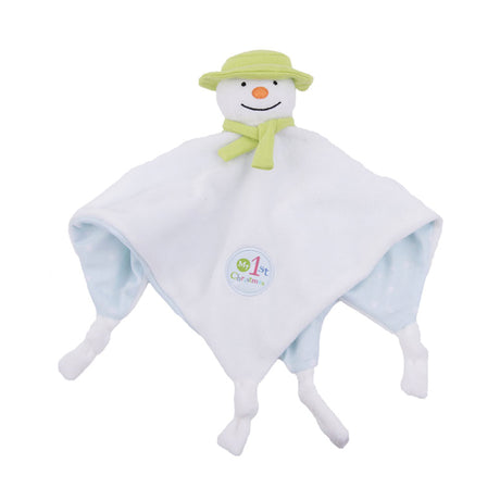 A plush toy resembling a snowman with a green hat and scarf, white blanket body, and an orange nose