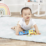 Baby in nursery with a Hungry Caterpillar baby soft educational number book