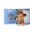 A plush toy resembling a tooth fairy character, with a blue box packaging that also features a picture of the toy.