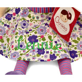 Floral-patterned doll with a personalised name embroidered on it and a Bonikka label.