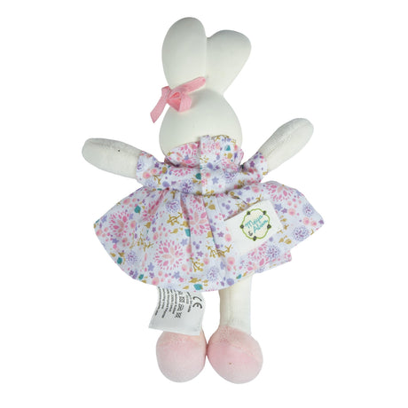White plush bunny toy with a floral dress on a white background